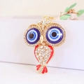 Schattige uil sleutelhanger met blauwe ogen en rood email op een gouden legering - Rood