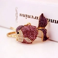 Sparkling goldfish keychain pendant with purple and pink crystals on gold-tone metal - Purple