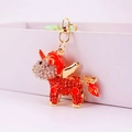 Llavero de unicornio con brillantes pedrería roja y blanca con acabado de metal dorado - Embalaje Individual / Naranja