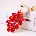 Peacock crystal keychain in red and rose pink rhinestones on a gold metal base - Red