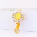 Gold tone Ruyi keychain variant with large yellow cat eye stone and white crystals - Yellow