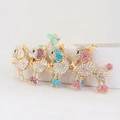 Sparkly poodle keychain set with colorful rhinestones on golden metal base - Random Color