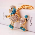 Porte-clés caniche scintillant avec cristaux bleus et blancs sur base dorée - Bleu