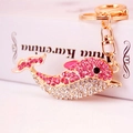 Sparkling pink and white rhinestone dolphin keychain with gold lobster clasp and key ring - Pink