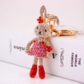Sparkly white and pink rhinestone bunny keychain with a flower and red boots - Red