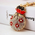 Llavero creativo bolsa de dinero dorada con diamantes de imitación rojos y esmalte - Rojo