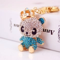 Funkelnder Panda-Schlüsselanhänger mit Krone und blauen Strasssteinen auf Goldring - Blau
