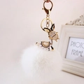 Detailed view of donkey keychain with white faux fur pompom and rhinestone crystals - Black Ears + White