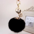 Dettaglio portachiavi a cervo con pompon nero, pietra occhio di gatto e strass luminosi - Orecchie Nere + Nero