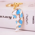 Porte-clés créatif en forme de corne dorée avec émail blanc, motifs bleus et strass brillants - Bleu