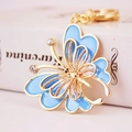 Exquisite golden butterfly keychain with blue enamel and sparkling rhinestones for handbags - Blue