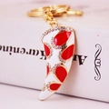 Porte-clés instrument de musique blanc et rouge avec zircons et finition dorée - Rouge