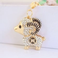 Simpatico portachiavi a capra dorata con strass scintillanti e motivi di monete nere - Bianco