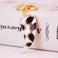 French horn keychain with gold trim and crystal accents in leopard print finish - Black