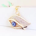 Exquisite evil eye keychain with sparkling rhinestones and blue enamel on gold metal - White