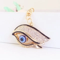 Exquisite gold-plated evil eye keychain with sparkling crystals and enamel details - Black