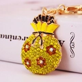 Portachiavi borsa della fortuna arancione con strass, catena d'oro e dettagli smaltati - Giallo Limone