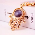 Golden Hamsa hand keychain with purple gemstone and sparkling white rhinestones - Single Pack / Purple Cat's Eye Stone
