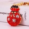 Sparkling red rhinestone lucky bag keychain with colorful floral accents and gold clasp - Red