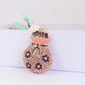 Charming money bag keychain with red crystal flower and pink enamel top on gold base - Peach