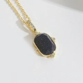 Collana dorata con pendente in pietra di sabbia blu e pietre di zircone scintillanti - Zirconia Nera Ovale