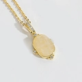 Elegante collana d'oro con pietra gialla ovale e accenti scintillanti di micro-zirconi - Zirconia Gialla Ovale
