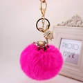 Cute pink faux fur ball keychain with rhinestone donkey charm and golden metal clip - Gold Ears + Rose Red