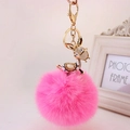 Creative donkey keychain with rhinestones and a large fluffy rose red fur pompom charm - Gold Ears + Rose Pink