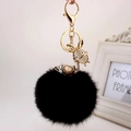 Fashionable black faux fur pompom keychain with golden rhinestone deer charm and cat eye stone - Gold Ears + Black