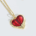 Elegant 14k gold necklace featuring a vibrant red enamel heart pendant with relief texture - Irregular Heart