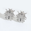 Silver ladybug earrings with white and black zircon crystals on white background - Beetle (Silver)