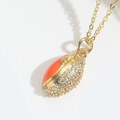 Unique gold football pendant with orange enamel and pavé-set cubic zirconia stones - Orange