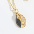 Golden American football pendant necklace with black enamel and sparkling zircon inlay - Black