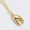 Elegant gold-plated necklace featuring a unique polished lobster claw pendant design - Gold Crab Claw