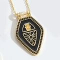 Golden Hamsa hand necklace featuring black enamel shield pendant and zircon accents - Black