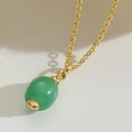 Elegant gold necklace featuring a green oval stone pendant with minimalist design - Green