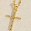Golden cross pendant necklace with clear sparkling crystals on a minimalist chain - Cross