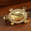 Vintage style golden turtle brooch with crystal rhinestones on dark wood surface - Turtle Style (Gold)