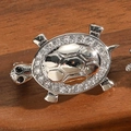 Vintage silver tortoise brooch with sparkling crystals on dark wood background - Turtle Style (Silver)