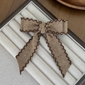 Elegant brown fabric bow hair clip with vintage wavy stitched edges on a display tray - Long Tail / Brown (6#)