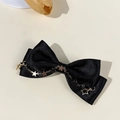Detail of black satin bow hair clip with gold metal chains and star charms pendant - Black - Chain Star Charms