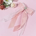 Detailed pink lace hair bow with heart-shaped crystal, pearls and long ribbons - Pink
