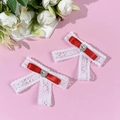 Detail of red ribbon and white lace hair clips with sparkling heart rhinestones - Red (1 Pair)