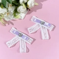 Detail of two-piece lace bow hair clips with purple ribbon and sparkling heart rhinestone - Purple