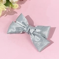 Elegant light blue satin bow hair clip for women featuring a minimalist Korean style design - Blue