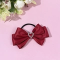 Close-up of wine red satin bow hair tie with sparkling heart rhinestone and elastic band - Burgundy