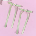 Set of two light green satin bow hair clips with daisy embroidery on pink background - Green (Pair)