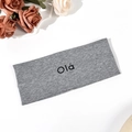Close-up of grey knitted yoga headband with black Olá letter print and soft texture - Gray