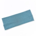 Macro shot of the ribbed texture on a wide elastic lake blue knitted yoga headband - Lake Blue