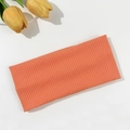 Detail of an orange ribbed knit headband showing the high elasticity and soft texture - Orange (FD05-19)